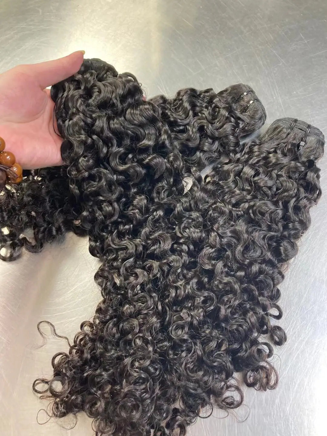 Unprocessed Raw Burmese Curly Bundles.
